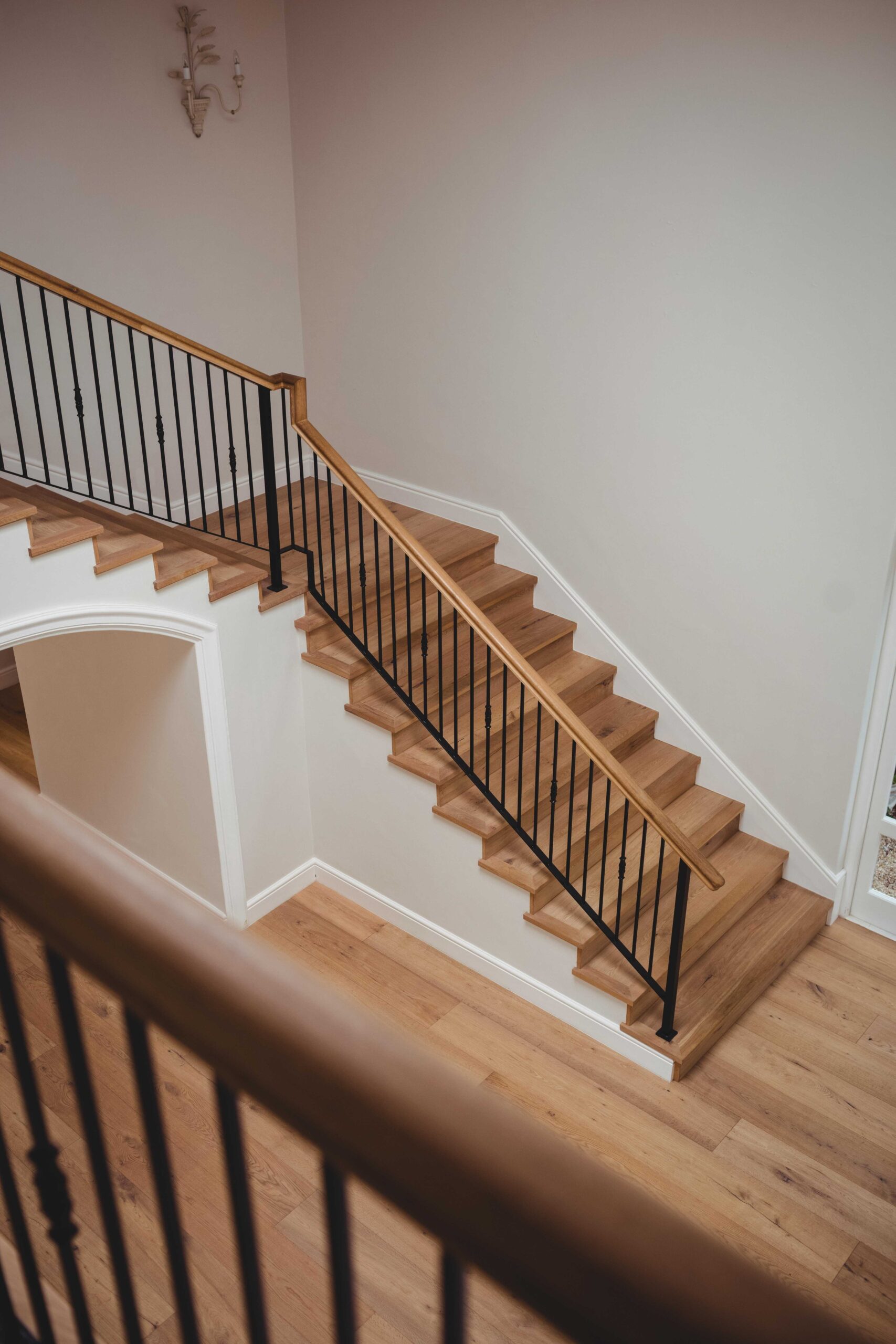 Oak staircase with black metal balustrade